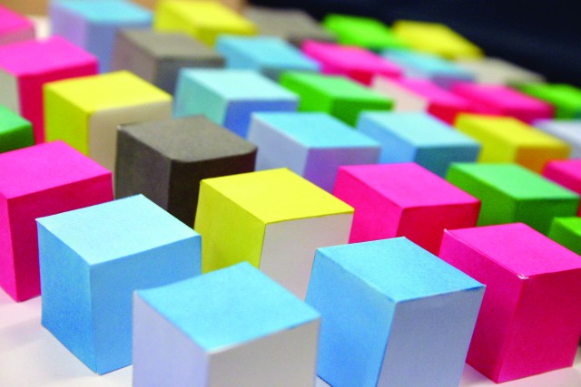 Coloured cubes on backing, close-up.