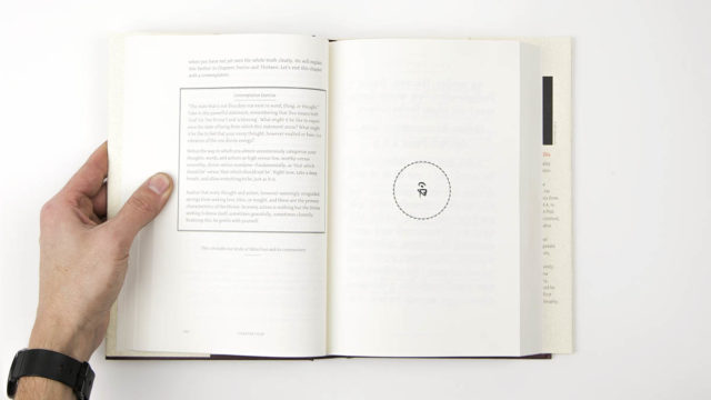 Interior spread of hard cover book showing text box on left, sutra image on right