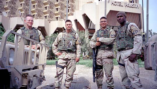 Four US soldiers pose for camera