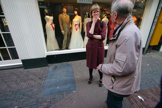 A Dutch friend and an old man talking to her.