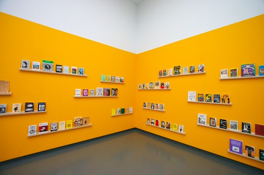 Yellow walls displaying books