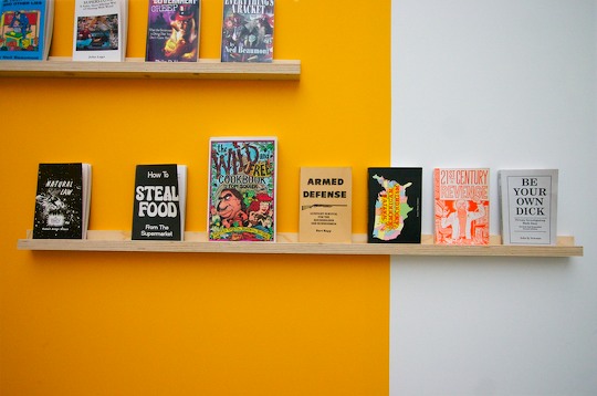 Yellow walls displaying books