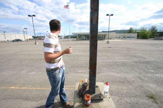 man eating chips in a Montana parking lot