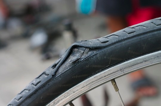 A large bulge in the front tire