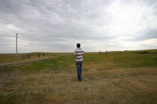 man standing in field