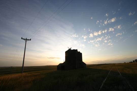 Old farm house in sunset