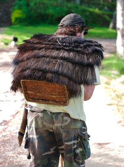 A man wearing a traditional backpack