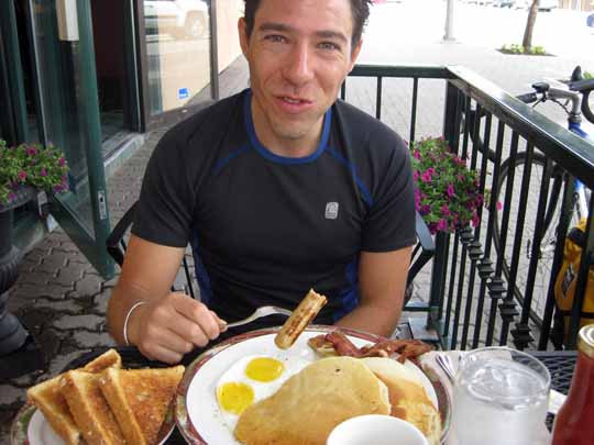 Man eating breakfast at a restaurant