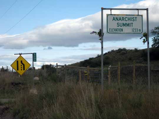 Road summit with sign