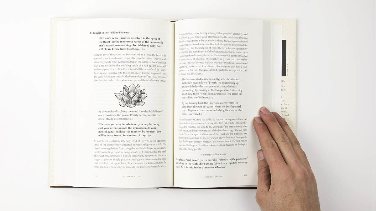 Interior spread of hard cover book showing illustration of lotus flower and text