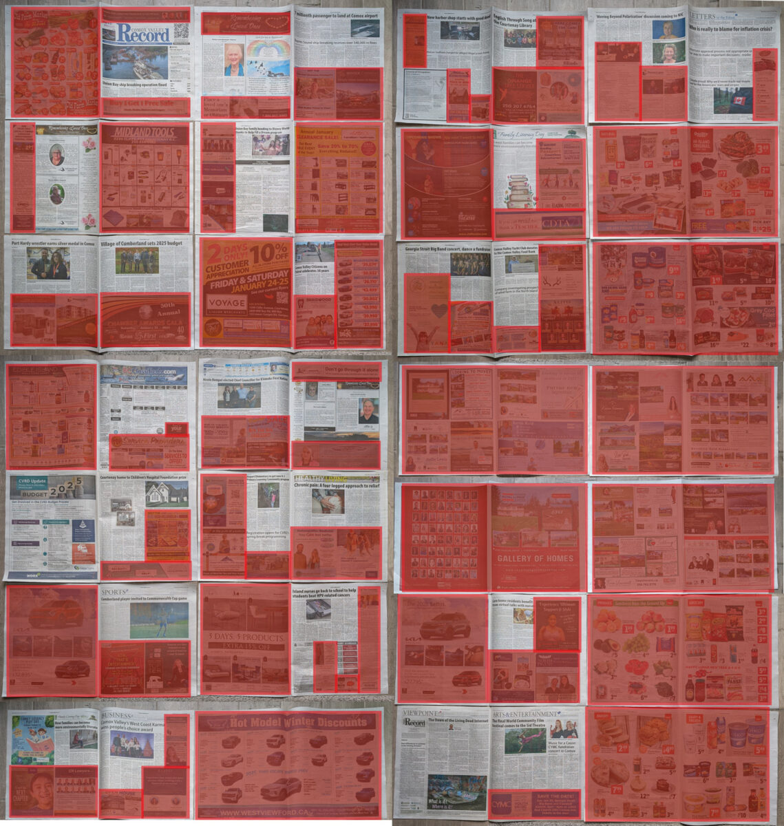 Newspaper spread out with red boxes overlaid on ads.